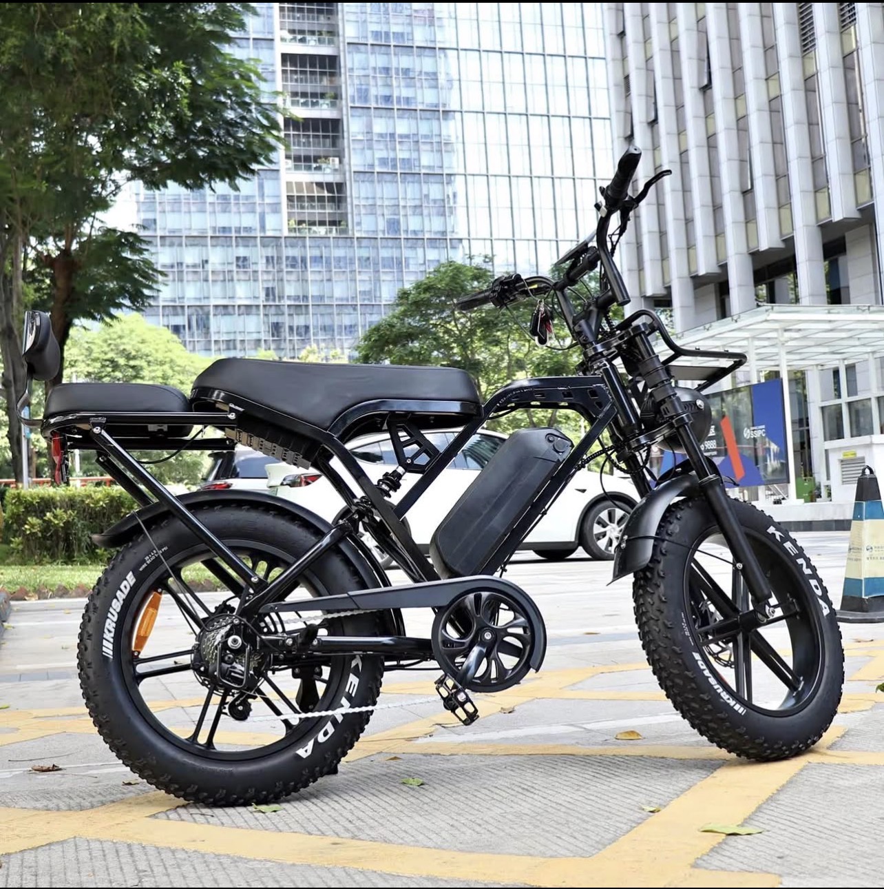Newxing X80PRO fat tyre electric bike in black, parked on a city street